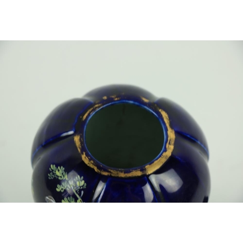 111 - A rare early 19th Century dark blue Continental porcelain 'pagoda' shaped Vase and Cover, with chino... 