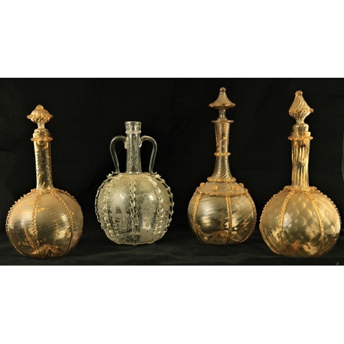 135 - Three similar Dutch yellow ground glass Decanters and stoppers, overlaid with glass ribbons and surm... 