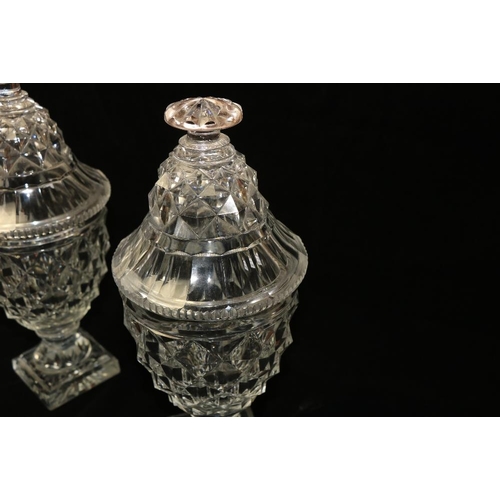 137 - A quality pair of early 19th Century Irish cutglass pineapple shaped Jars and covers, on square base... 