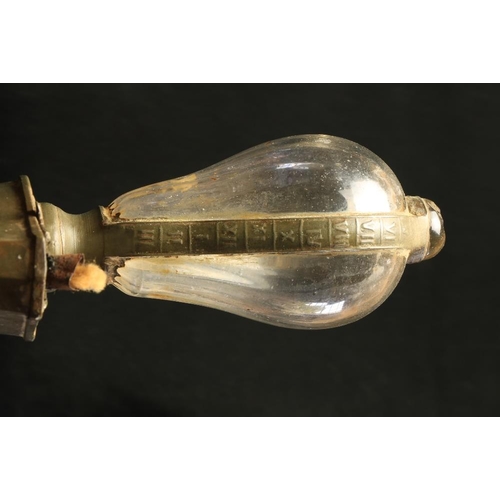 139 - An 18th Century pewter Desk Light, with original glass bulbous oil container and finger handle on a ... 