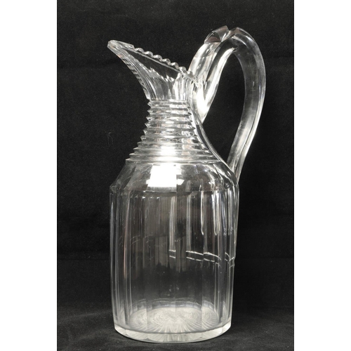 141 - A fine quality late 18th Century / early 19th Century Irish sparrow beak glass Wine Jug, with serrat... 