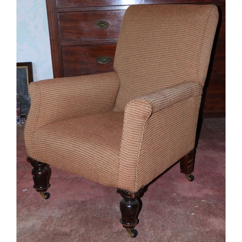 179 - A Victorian style Easy Armchair, with padded back, sides and seat on front baluster turned legs; tog... 