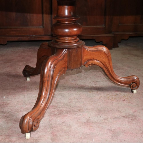 182 - A circular Victorian walnut Breakfast Table, with moulded top on tripod base, 46