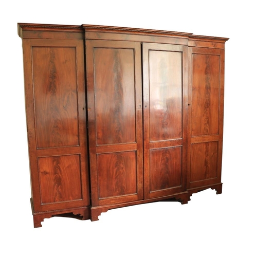 187 - A late George IV mahogany breakfront Wardrobe, with Greek key moulded cornice above four double pane... 