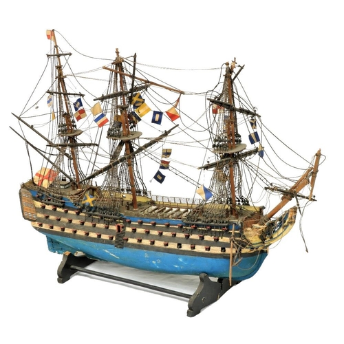 212 - A painted wooden Model of HMS Victory, with three masts and various flags, 17