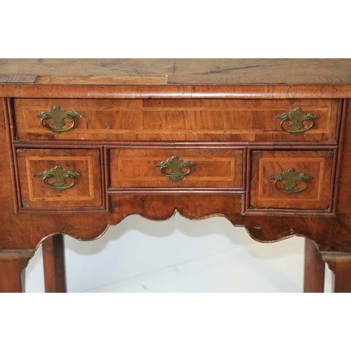 215 - An 18th Century walnut Lowboy, the crossbanded top with herringbone inlay over single frieze drawer,... 