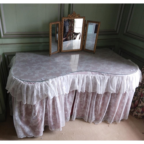 284 - A modern kidney shaped wooden Dressing Table, with glass top, and lace drapes, approx. 63