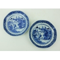 A pair of Kangshi blue and white Chinese porcelain Dishes, each decorated with figures and residence... 