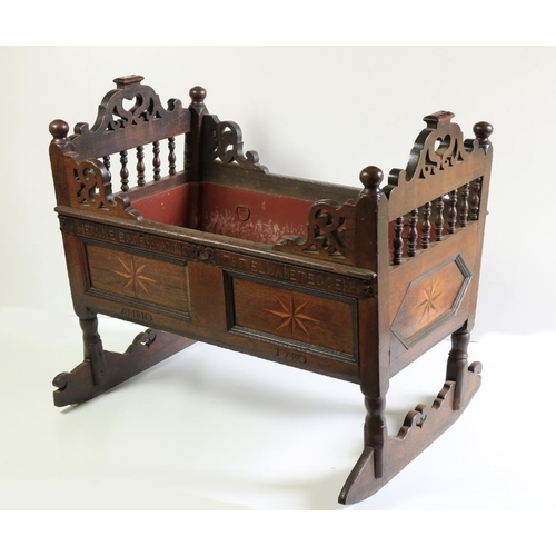 351 - An 18th Century oak Child's Rocking Cradle, the pierced ends with turned balustrades, above star inl... 