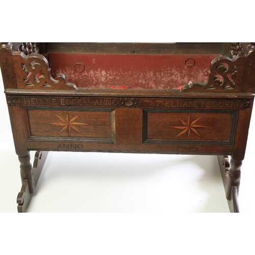 351 - An 18th Century oak Child's Rocking Cradle, the pierced ends with turned balustrades, above star inl... 