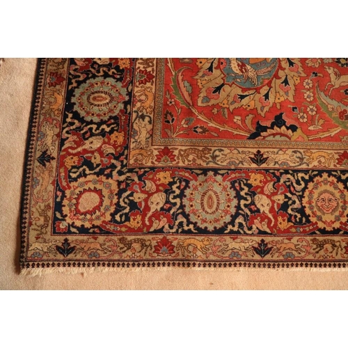 382 - A magnificent Persian polychrome semi-antique Carpet, the red ground profusely decorated with images... 