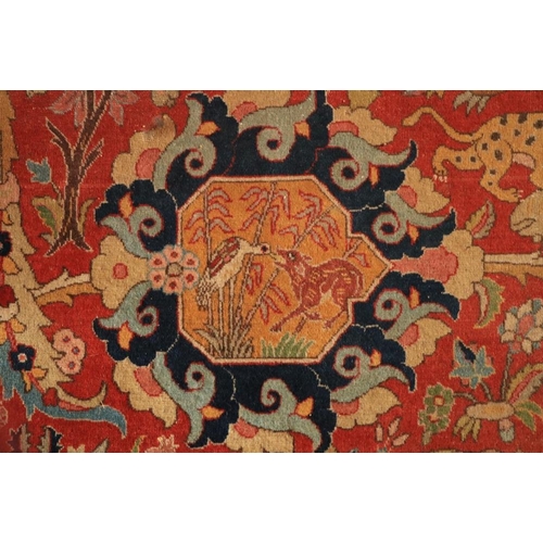 382 - A magnificent Persian polychrome semi-antique Carpet, the red ground profusely decorated with images... 