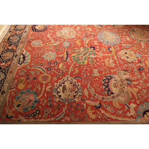 382 - A magnificent Persian polychrome semi-antique Carpet, the red ground profusely decorated with images... 