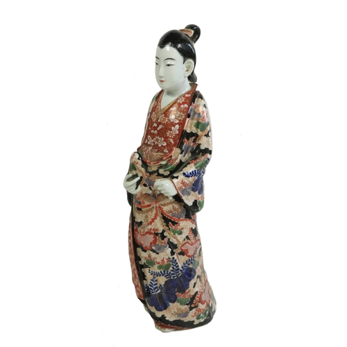 395 - A fine quality and colourfully decorated 19th Century Japanese porcelain Figure, modelled as a 'Geis... 