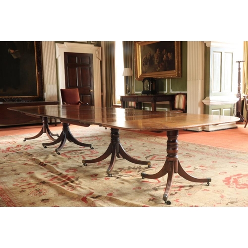 417 - A magnificent Georgian period mahogany Dining Table, on two quadruple centre pods, and two outer tri... 