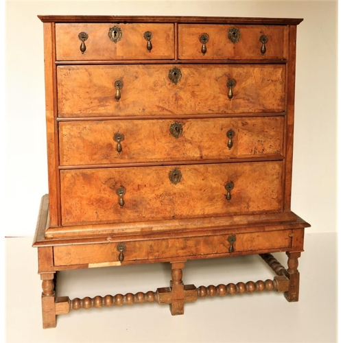 448 - An early 18th Century figured walnut Chest on Stand, the crossbanded top with moulded edge, over two... 