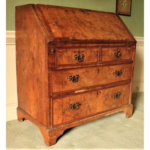 457 - A very fine George II period walnut slope front Bureau, the finely figured crossbanded top and drop ... 