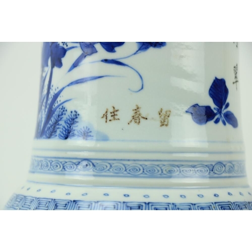 46 - A large important Kangxi period blue and white Gu Vase, 18th Century, decorated with birds and flowe... 