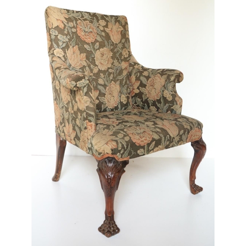 469 - An 18th Century Irish mahogany Library Armchair, with padded back and arms covered in floral tapestr... 