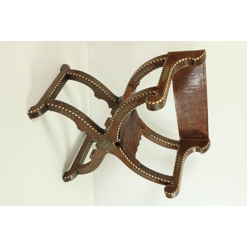 568 - A hip joint X frame Hispano Moresque Open folding Armchair, inlaid with bone and ivory and rows of s... 