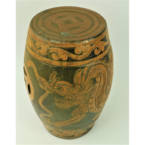 67 - A 19th Century Chinese brown and black glazed stoneware Garden Seat, decorated with a four claw drag... 