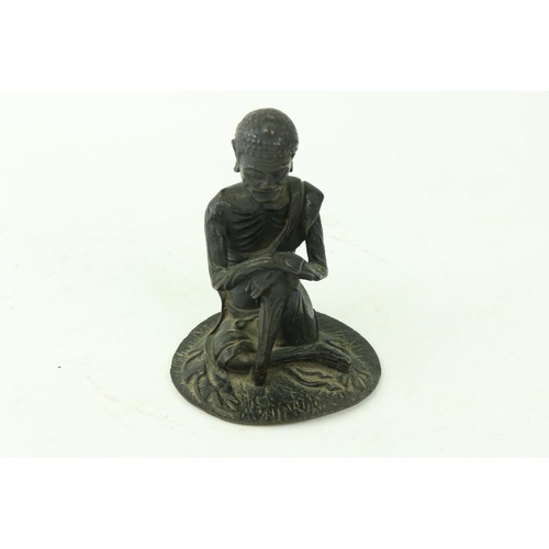 70 - An early Chinese or Tibetan bronze Figure, of a seated Buddha with hands resting on left knee, 4 3/4... 