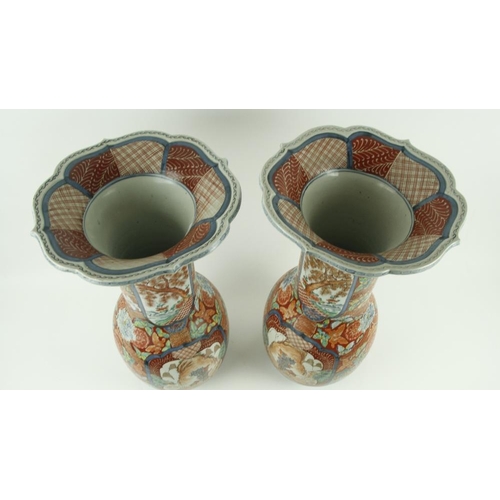 74 - A pair of attractive and heavy 19th Century Japanese porcelain Vases, of flared and bulbous form, th... 