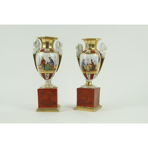 88 - A pair of 19th Century French porcelain two handled Urns, each decorated in the chinoiserie style fi... 