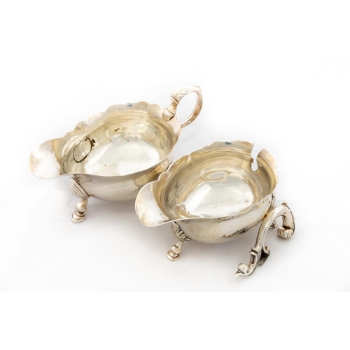 771 - A fine rare pair of George II silver crested Sauceboats, one by John Poyne, London c. 1740, each wit... 