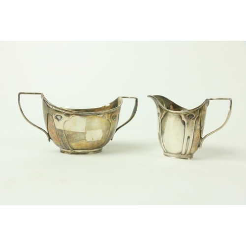 805 - An Art Nouveau decorated English silver Cream Jug, and a two handled bowl by William Hutton and Sons... 