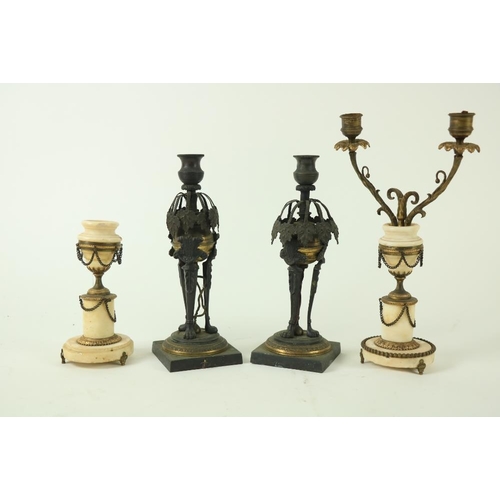 841 - A pair of Regency bronze and gilt bronze Candlesticks, each with an urn socket above hanging vine le... 