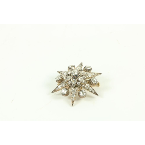 862 - A fine quality star Brooch, mounted on silver and gold, set with 55 round old cut diamonds (total ca... 