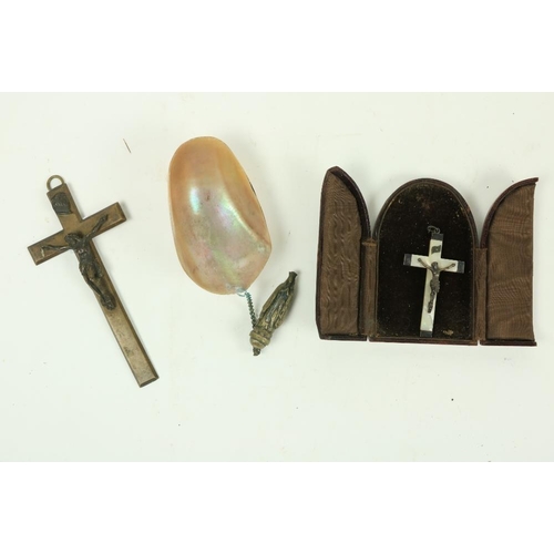 888 - A small mother-o-pearl and silver Crucifix, in arched leather table case, another large late Victori... 