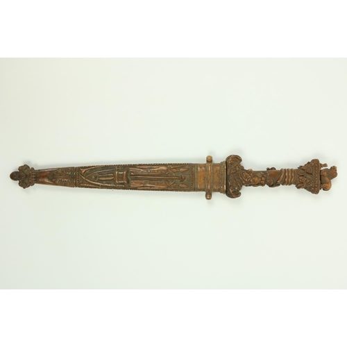 906 - A very rare Ottoman carved walnut Hunting Dagger, the hilt with lion and snake pommel, the grip with... 