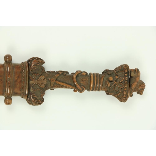 906 - A very rare Ottoman carved walnut Hunting Dagger, the hilt with lion and snake pommel, the grip with... 