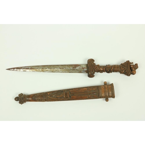 906 - A very rare Ottoman carved walnut Hunting Dagger, the hilt with lion and snake pommel, the grip with... 