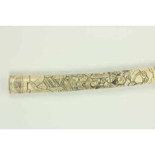 907 - A Japanese carved bone Tanto (Dagger), the scabbard and hilt carved with numerous figures, 17