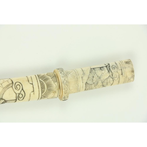 907 - A Japanese carved bone Tanto (Dagger), the scabbard and hilt carved with numerous figures, 17