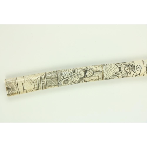 907 - A Japanese carved bone Tanto (Dagger), the scabbard and hilt carved with numerous figures, 17