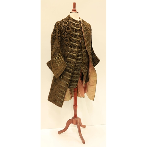 948 - A late 18th Century silk brocade brown Gentleman's Coat, with all over floral pattern, two side pock... 