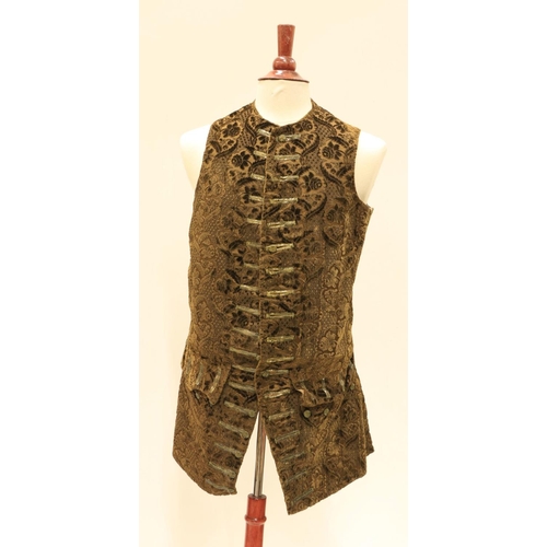 948 - A late 18th Century silk brocade brown Gentleman's Coat, with all over floral pattern, two side pock... 