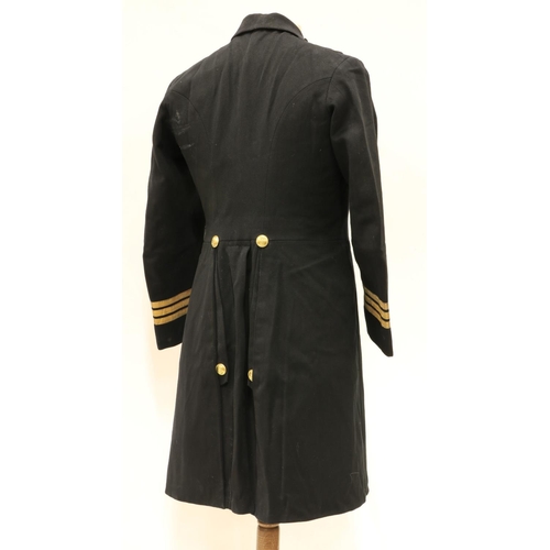 953 - A Royal Navy Officer's Uniform, with overcoat, jacket, pair of trousers, mess jacket, a pair of epau... 