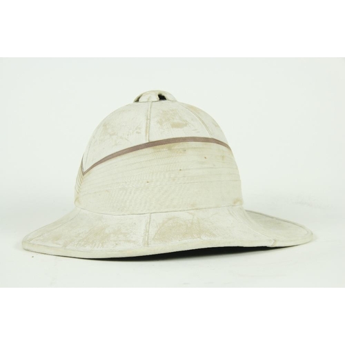 964 - An early 20th Century English Pith Helmet, size 6 5/8