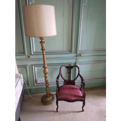 285 - A gilt leaf moulded Lamp Standard; together with an inlaid and carved Edwardian Armchair of low prop... 