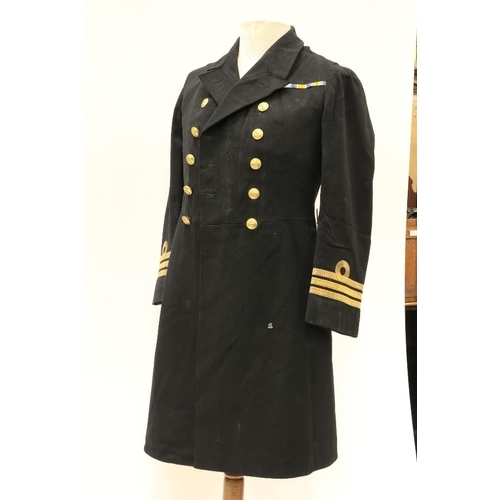 953 - A Royal Navy Officer's Uniform, with overcoat, jacket, pair of trousers, mess jacket, a pair of epau... 