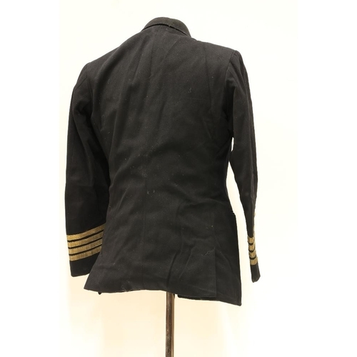 953 - A Royal Navy Officer's Uniform, with overcoat, jacket, pair of trousers, mess jacket, a pair of epau... 