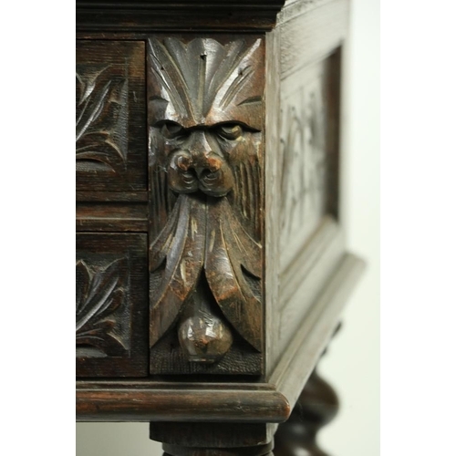 171 - An oak 17th Century style kneehole Desk, profusely carved with scrolling foliage and animal masks on... 