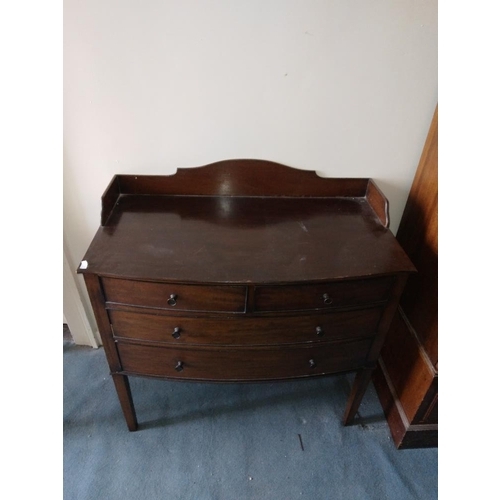 243 - A George III style mahogany circular two tier Dumbwaiter, with serpentine shaped shelves and tripod ... 