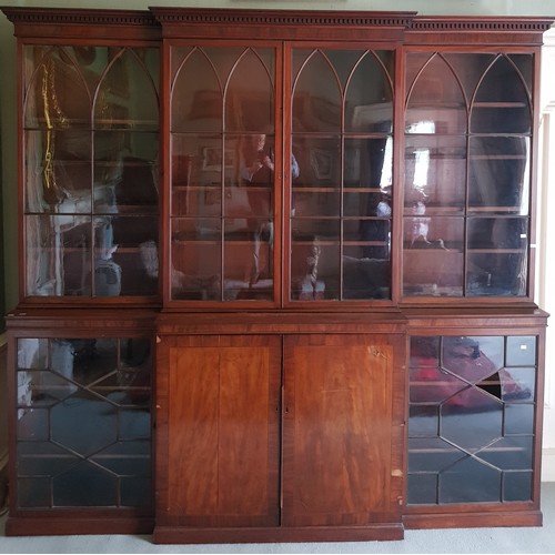 466 - A fine quality Georgian mahogany breakfront Bookcase, the dentil moulded cornice over four Gothic ar... 