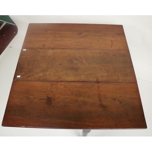 311 - An Irish mahogany drop leaf Table, 18th Century, with rectangular flaps on four tapering turned legs... 